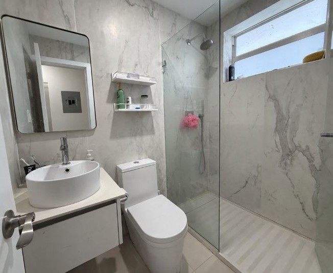 Renovated bathroom with glass shower