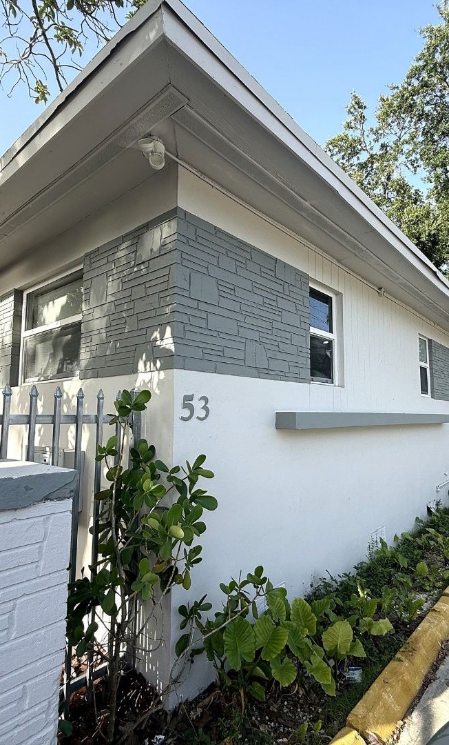 53 NE 56th St building exterior and gated entry