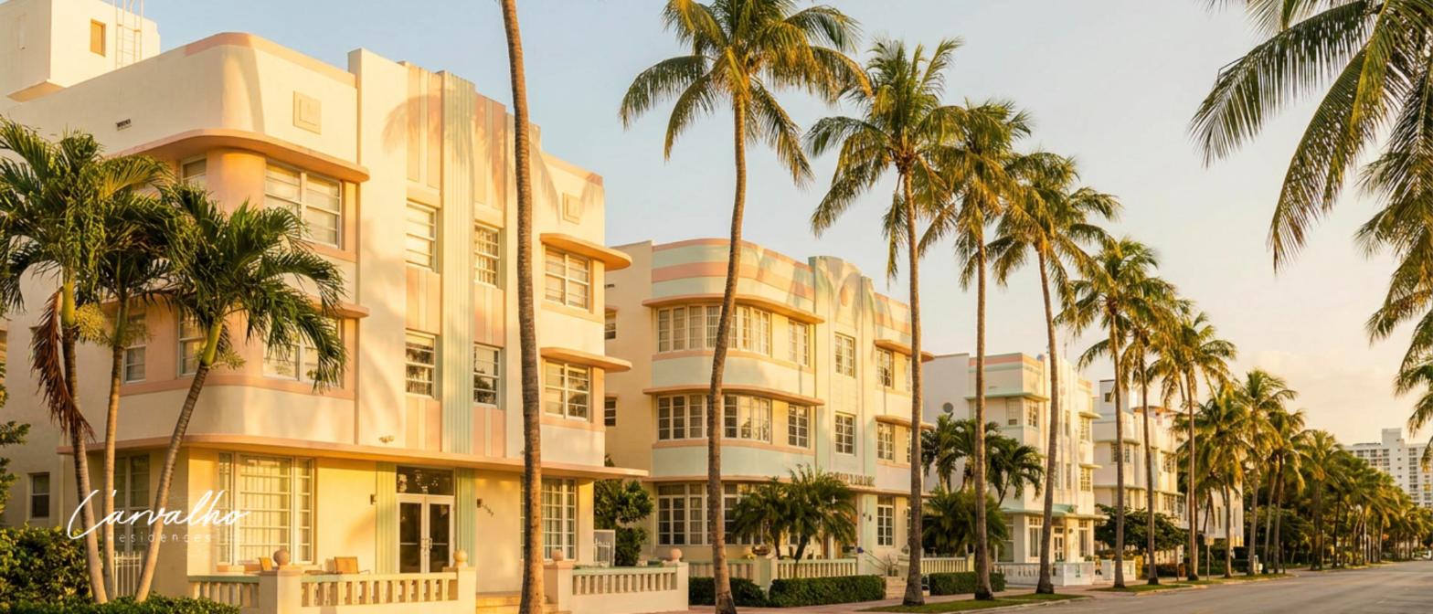 Art Deco residences on a palm-lined Miami Beach street at golden hour